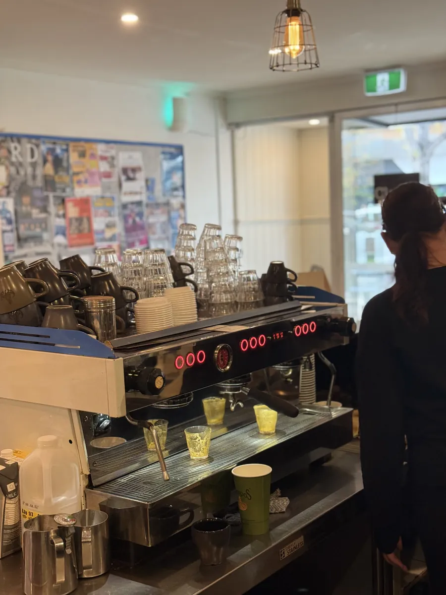 The espresso machine stacked with cups and glasses