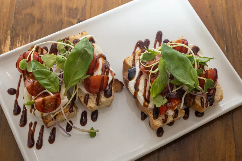 Bruschetta caprese with tomato, mozzarella and balsamic