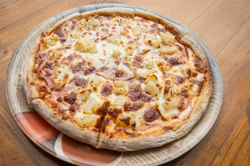 Hawaiian pizza with ham and pineapple