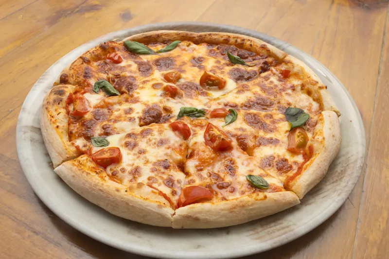 Margherita pizza with cherry tomatoes and basil