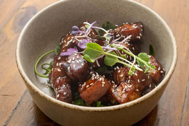 Honey soy pork belly bites with sesame