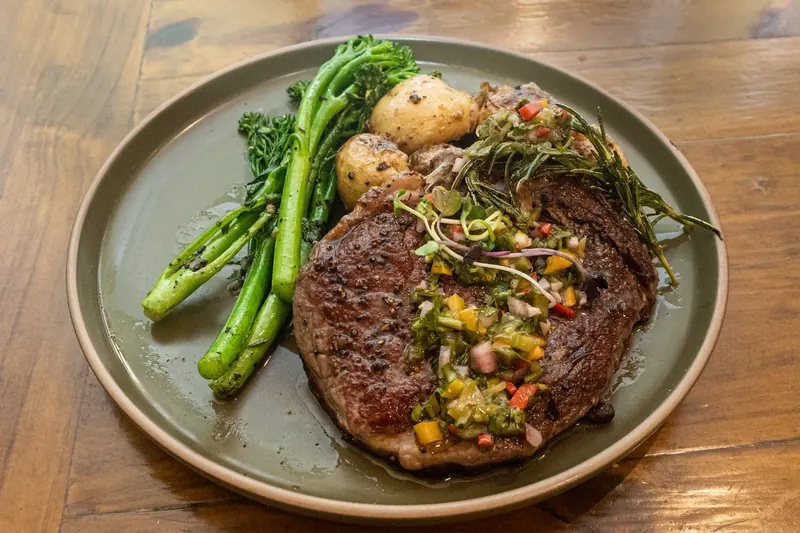 Scotch fillet with potatoes, broccolini and chimichurri